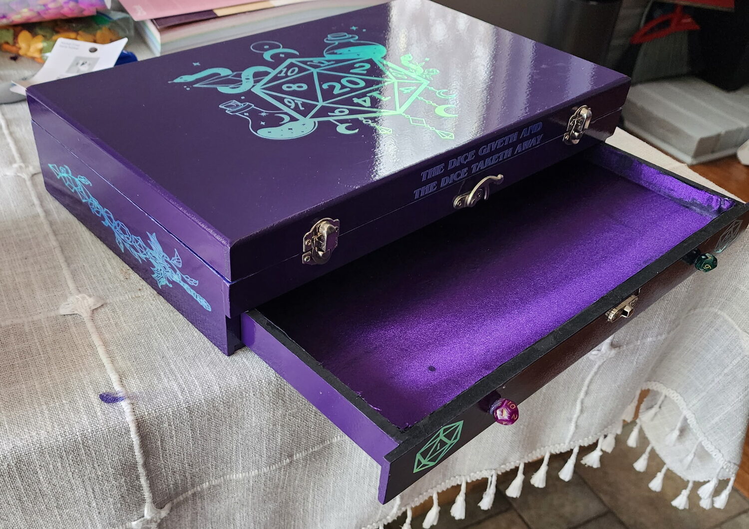 Violet dice box with a holographic lid and a pull-out velvet drawer beneath